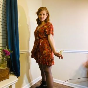 Medium flattering burnt orange floral dress.